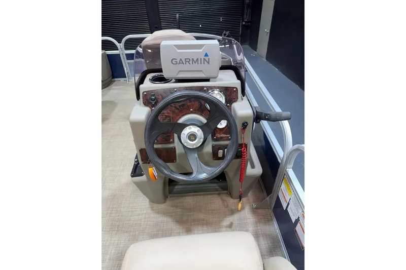 Slide: The Image of 2023 Sun Tracker Bass Buggy 18 DLX steering console with Garmin navigation system. - 16