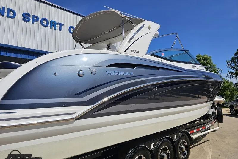 Slide: The Image of 2015 Formula 350 Sun Sport boat on trailer at dealership. - 10