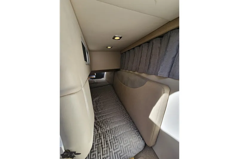 Slide: The Image of 2015 Formula 350 Sun Sport cabin interior with bed and curtains. - 101