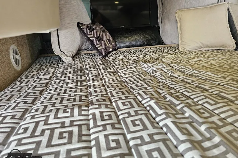 Slide: The Image of Luxurious cabin interior of 2015 Formula 350 Sun Sport with patterned bedding and pillows. - 102