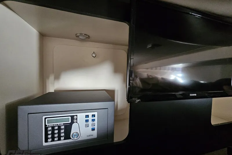 Slide: The Image of Safe and TV inside 2015 Formula 350 Sun Sport cabin. - 103