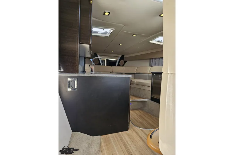 Slide: The Image of Interior of 2015 Formula 350 Sun Sport boat, featuring beige seating and modern amenities. - 104