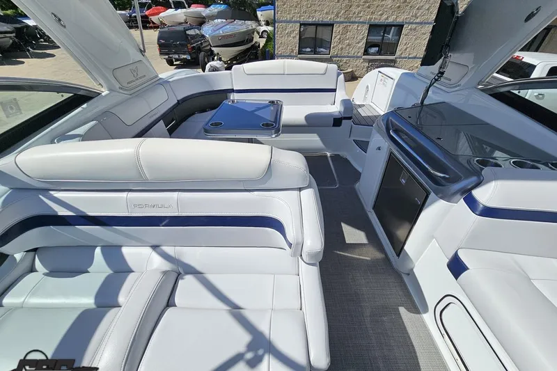 Slide: The Image of Luxurious interior of a 2015 Formula 350 Sun Sport boat with white seating and amenities. - 110