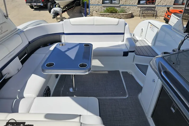 Slide: The Image of 2015 Formula 350 Sun Sport boat interior with seating and table setup. - 112