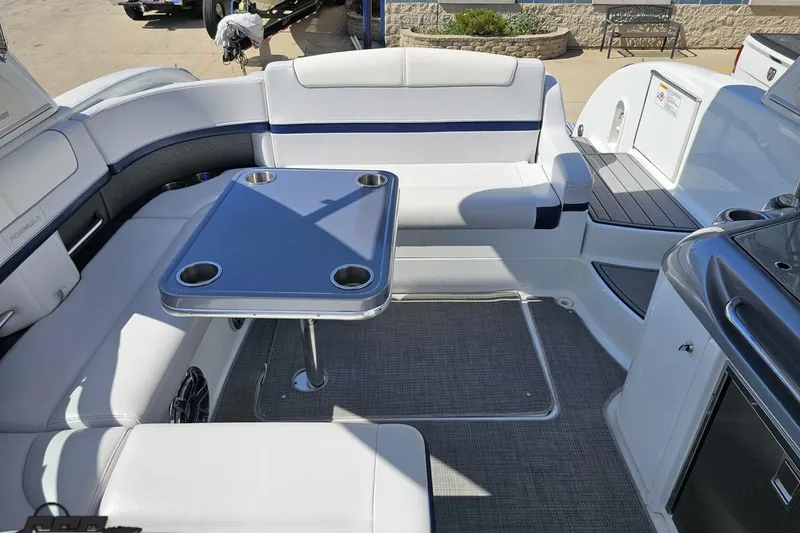 Slide: The Image of Interior of a 2015 Formula 350 Sun Sport boat with seating and table. - 113