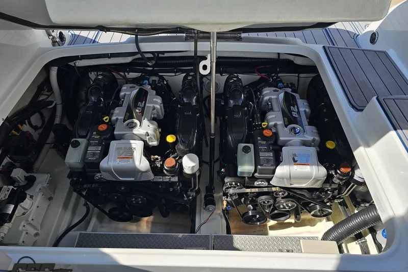 Slide: The Image of Engine compartment of a 2015 Formula 350 Sun Sport boat, showcasing dual powerful engines. - 119