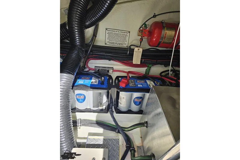 Slide: The Image of Engine compartment of 2015 Formula 350 Sun Sport with batteries and fire extinguisher. - 122