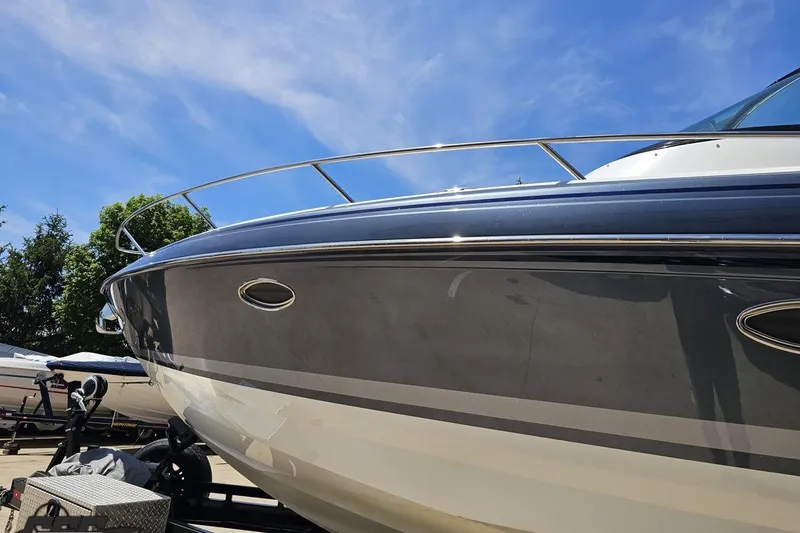 Slide: The Image of 2015 Formula 350 Sun Sport boat with sleek design under clear blue sky. - 21