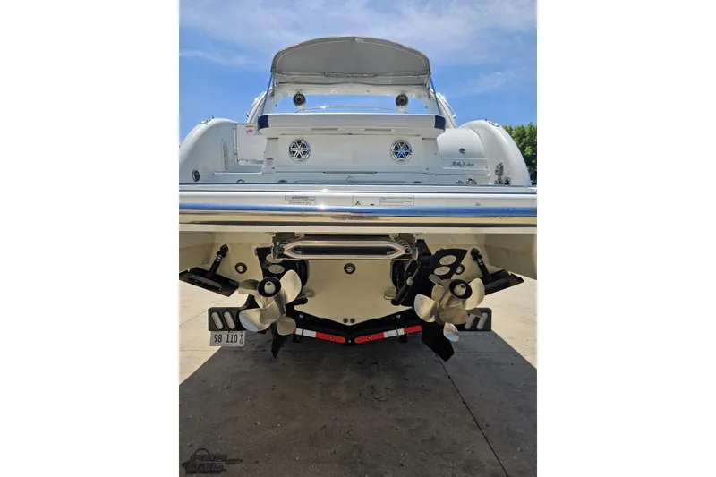 Slide: The Image of 2015 Formula 350 Sun Sport boat rear view with dual propellers and sleek design. - 29