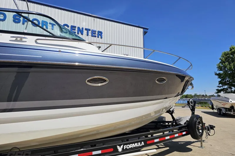 Slide: The Image of 2015 Formula 350 Sun Sport boat on trailer at a sport center. - 4