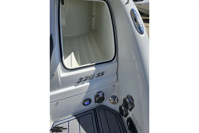 Slide: The Image of 2015 Formula 350 Sun Sport boat interior, showcasing storage compartment and control panel. - 42