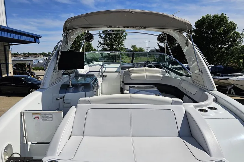 Slide: The Image of 2015 Formula 350 Sun Sport boat with spacious seating and modern amenities, docked outdoors. - 43