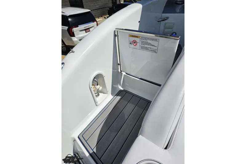 Slide: The Image of 2015 Formula 350 Sun Sport boat interior with sleek seating and safety warning sign. - 46