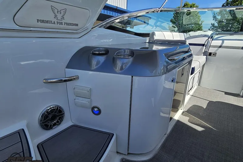 Slide: The Image of 2015 Formula 350 Sun Sport boat interior with seating and cup holders. - 48