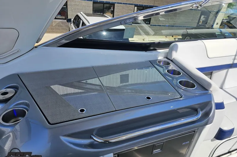 Slide: The Image of Interior of a 2015 Formula 350 Sun Sport boat with cup holders and sleek design. - 51