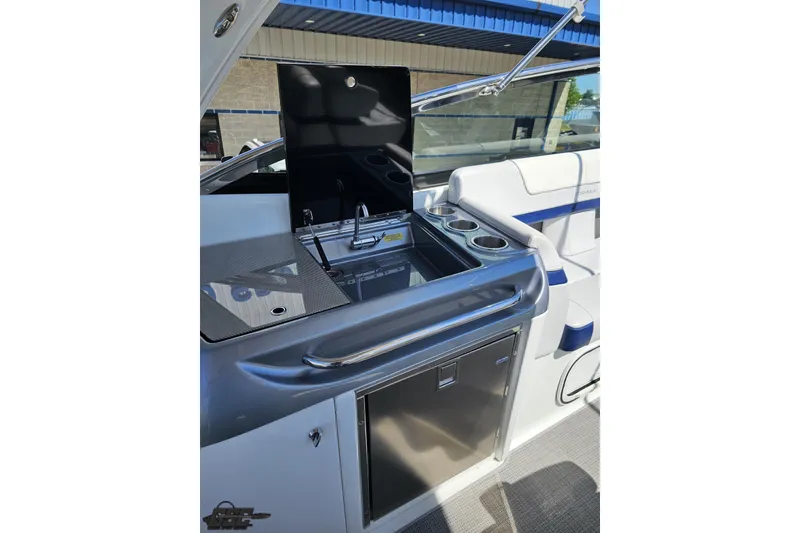 Slide: The Image of 2015 Formula 350 Sun Sport boat interior with kitchenette and seating area. - 52