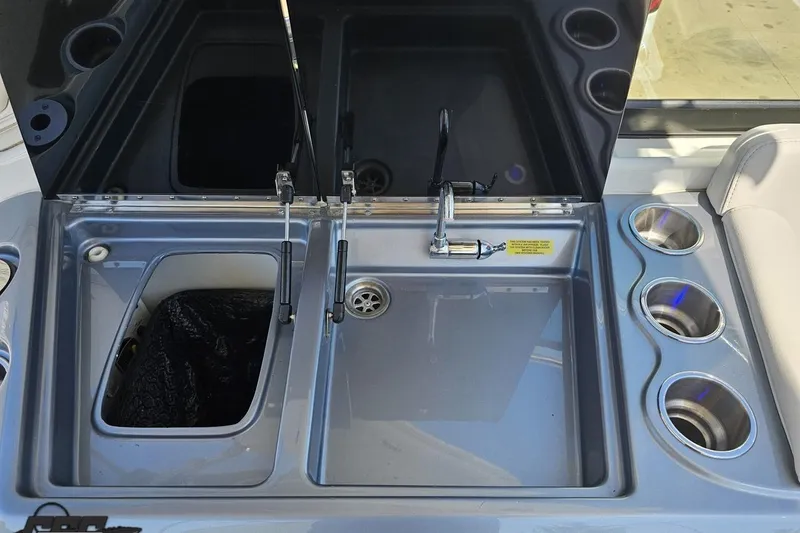 Slide: The Image of 2015 Formula 350 Sun Sport boat sink and cup holders in cockpit area. - 53