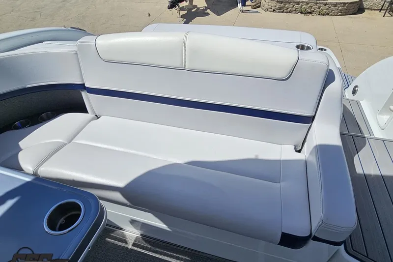Slide: The Image of 2015 Formula 350 Sun Sport boat seating with white upholstery and cup holders. - 57