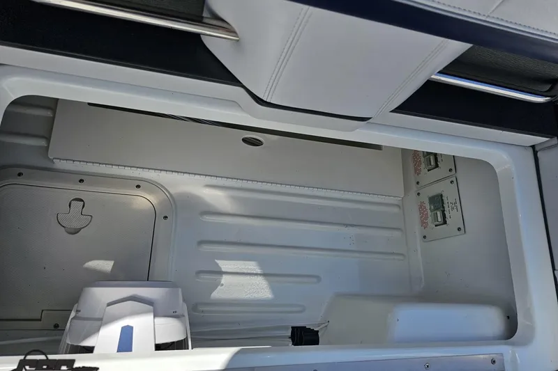 Slide: The Image of Storage compartment of a 2015 Formula 350 Sun Sport boat, featuring sleek white interior design. - 60