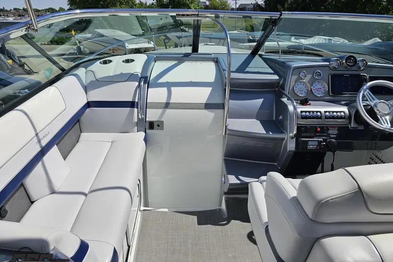 Slide: The Image of Interior of a 2015 Formula 350 Sun Sport boat with seating and control panel. - 62