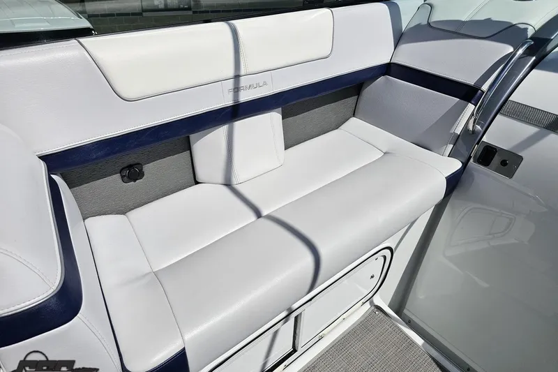 Slide: The Image of 2015 Formula 350 Sun Sport boat interior with white and blue cushioned seating. - 63