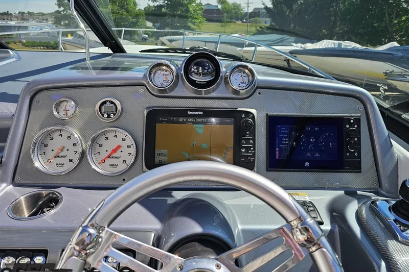 Slide: The Image of Dashboard of a 2015 Formula 350 Sun Sport boat with navigation and gauges. - 69