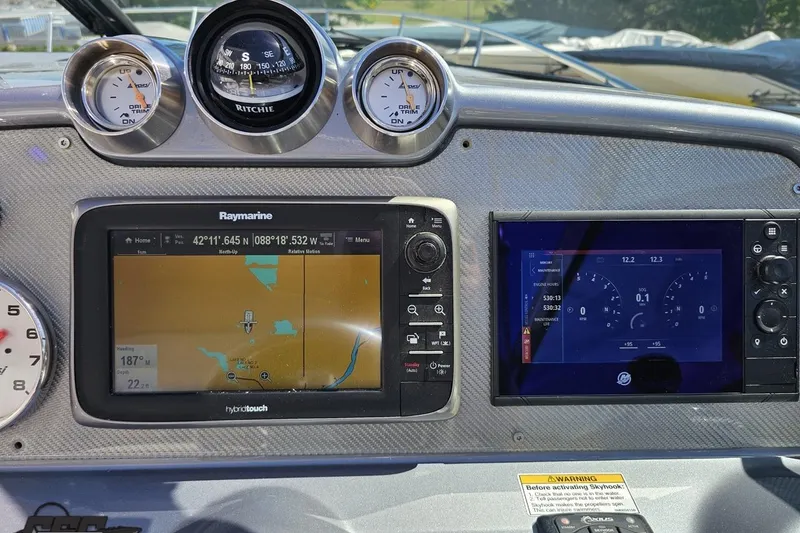 Slide: The Image of Dashboard of a 2015 Formula 350 Sun Sport with navigation and control displays. - 70