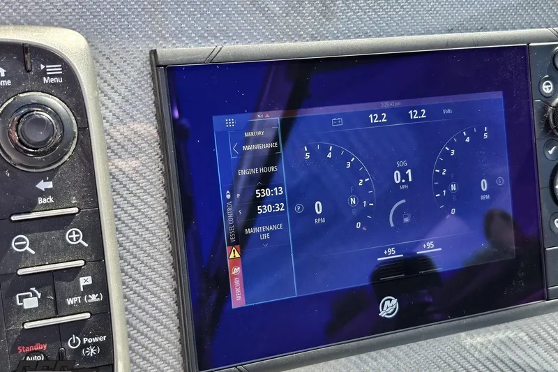 Slide: The Image of Dashboard of a 2015 Formula 350 Sun Sport showing engine hours and voltage. - 71