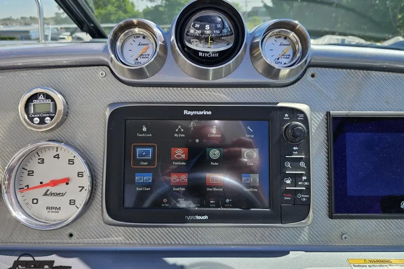 Slide: The Image of Dashboard of a 2015 Formula 350 Sun Sport boat with navigation controls. - 72