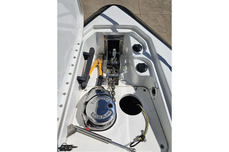 Slide: The Image of 2015 Formula 350 Sun Sport boat anchor compartment with winch and chain. - 77