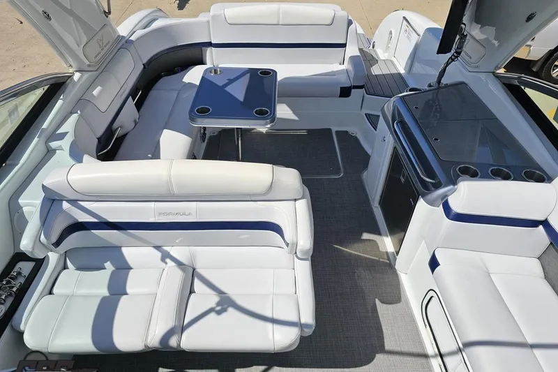 Slide: The Image of 2015 Formula 350 Sun Sport boat interior with white seating and a central table. - 81