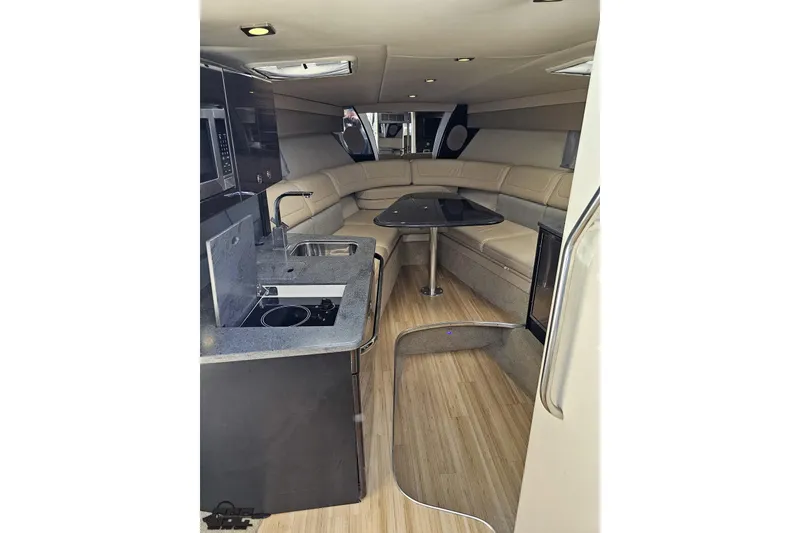 Slide: The Image of Interior of 2015 Formula 350 Sun Sport boat with kitchenette and seating area. - 82