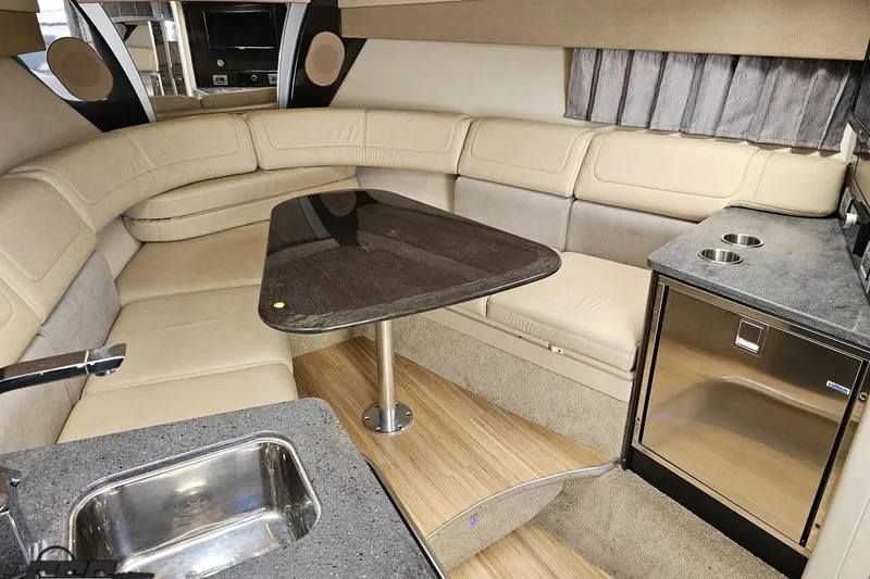 Slide: The Image of Luxurious interior of a 2015 Formula 350 Sun Sport boat with seating and kitchenette. - 85
