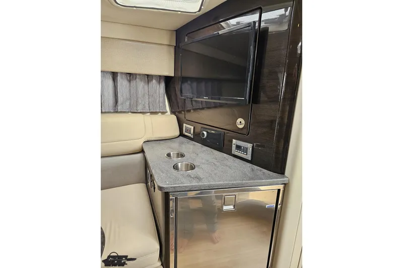 Slide: The Image of Interior of 2015 Formula 350 Sun Sport with TV, countertop, and seating area. - 87