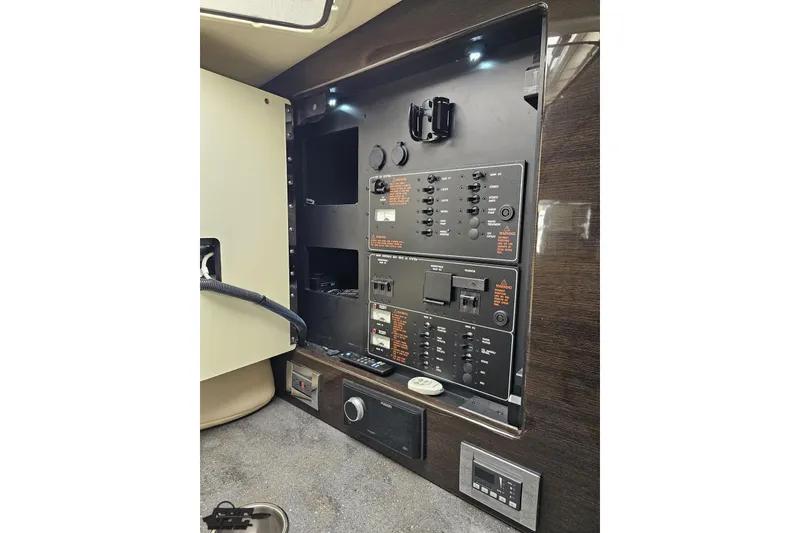 Slide: The Image of Control panel of a 2015 Formula 350 Sun Sport boat, featuring switches and indicators. - 88