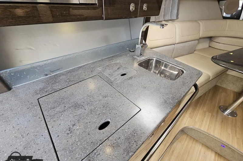 Slide: The Image of 2015 Formula 350 Sun Sport interior with sleek kitchenette and comfortable seating area. - 90