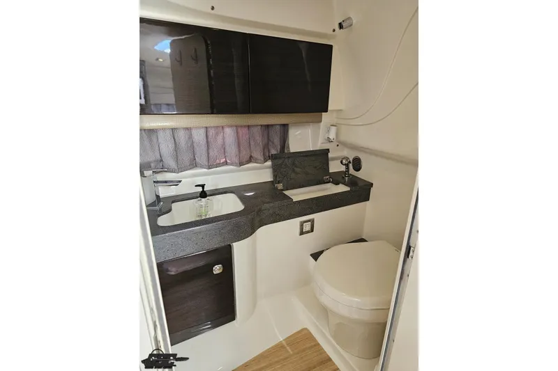 Slide: The Image of Interior of 2015 Formula 350 Sun Sport boat bathroom with sink and toilet. - 95