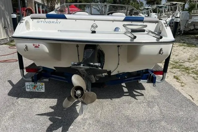 Slide: The Image of 2005 Stingray 180 RX boat rear view with visible propeller and Florida license plate. - 1