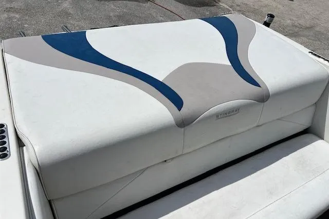 Slide: The Image of 2005 Stingray 180 RX boat seat with blue and gray accents. - 3
