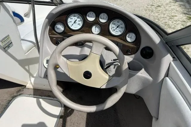 Slide: The Image of Steering wheel and dashboard of a 2005 Stingray 180 RX boat. - 6