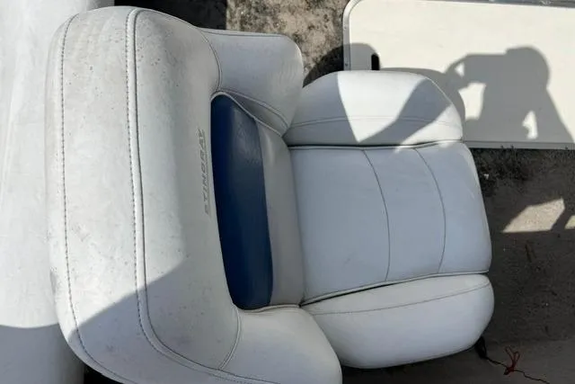Slide: The Image of White and blue boat seat from a 2005 Stingray 180 RX, showing slight wear. - 7