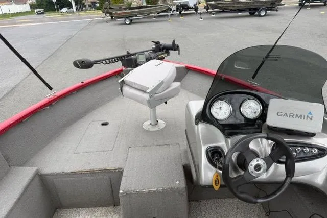 Slide: The Image of 2011 Tracker Pro Guide V-175 SC boat interior with Garmin navigation system. - 13