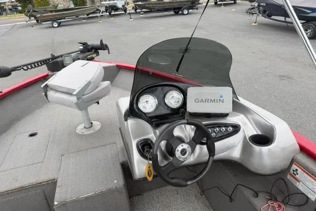 Slide: The Image of 2011 Tracker Pro Guide V-175 SC boat dashboard with Garmin GPS and steering wheel. - 14