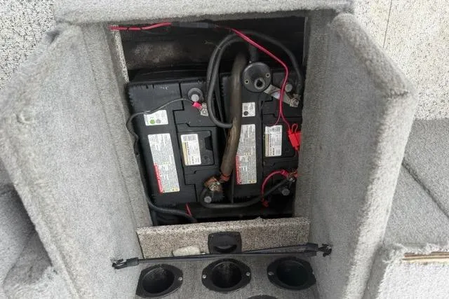 Slide: The Image of Battery compartment of 2011 Tracker Pro Guide V-175 SC boat, showing wiring and connections. - 17