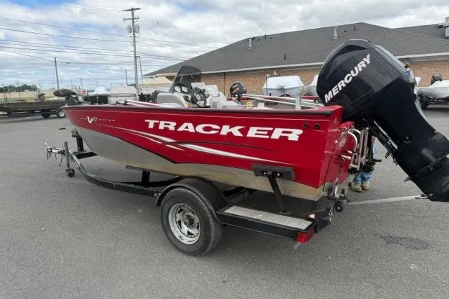 Slide: The Image of 2011 Tracker Pro Guide V-175 SC boat with Mercury engine on trailer. - 2