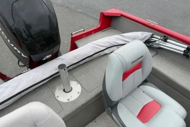 Slide: The Image of 2011 Tracker Pro Guide V-175 SC boat interior with seating and motor detail. - 3