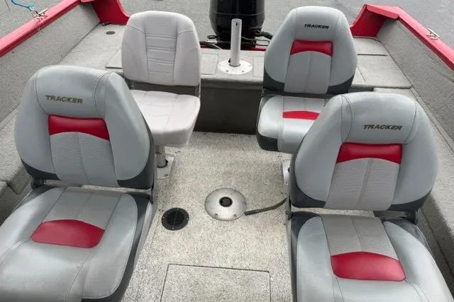 Slide: The Image of 2011 Tracker Pro Guide V-175 SC boat interior with four cushioned seats. - 9