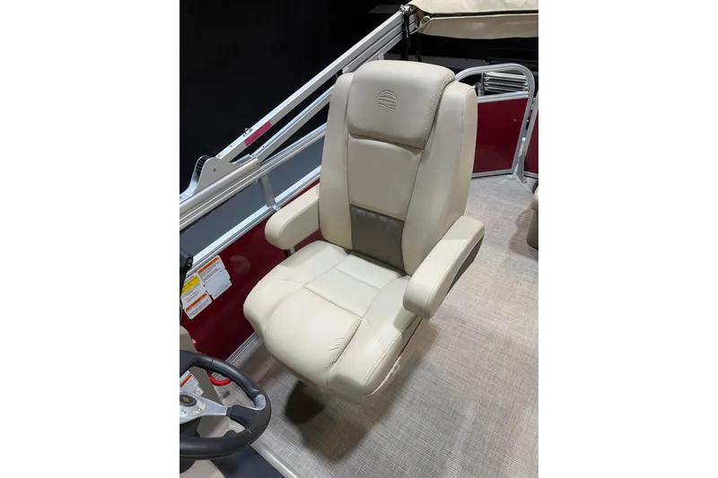 Slide: The Image of 2023 Sun Tracker Party Barge 20 DLX captain's chair, beige upholstery, sleek design. - 12