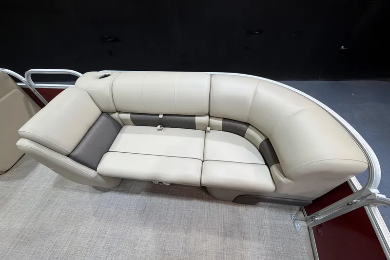 Slide: The Image of 2023 Sun Tracker Party Barge 20 DLX seating area with beige upholstery and modern design. - 6