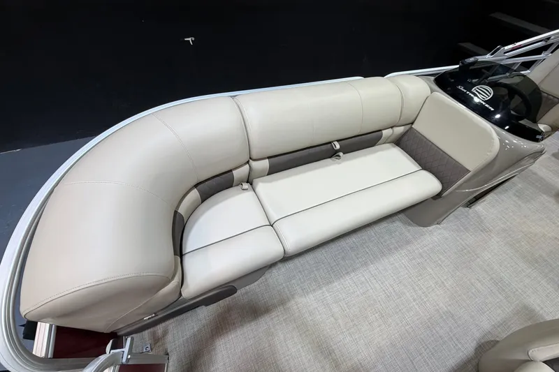 Slide: The Image of 2023 Sun Tracker Party Barge 20 DLX interior seating, featuring plush beige upholstery. - 8